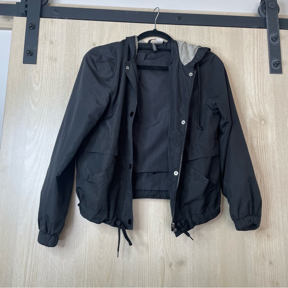 Light zipper jacket with gray enclosed hoodie